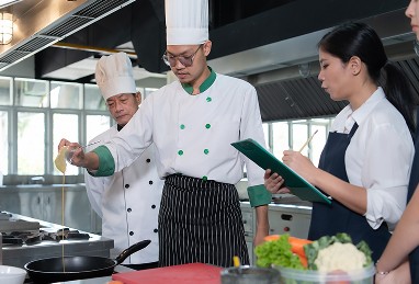Chefs and staff coordinating in the kitchen